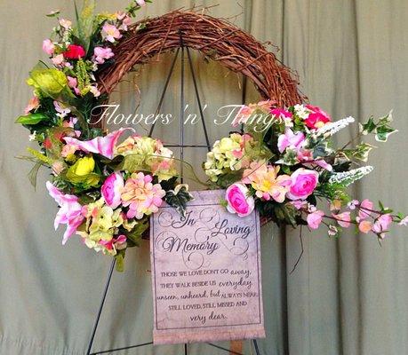 Grapevne wreath of silk flowers with inspirations banner