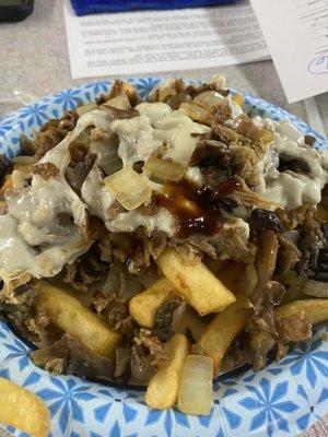 Steak n cheese on top of the fries. Very good!!