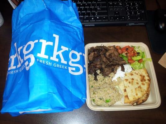 a plate with Lamb & Beef Yeero, Grk Tzatziki, and Brown Rice