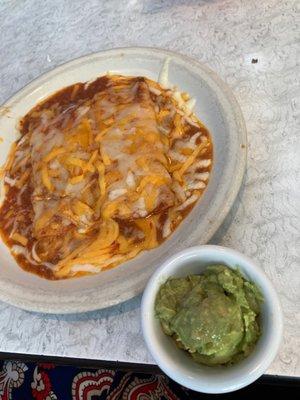 Cheese enchiladas with meat sauce and a guacamole