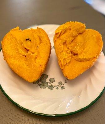 Inside the "egg fruit" aka canistel - soft and creamy with a large pit like a mango