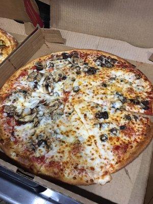 Well done thin crust with black olives, along with mushrooms and onions on one side