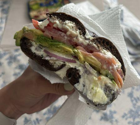 Pumpernickel bagel with salmon, avocado, tomato, onion and cream cheese