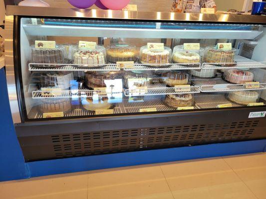 Mostly large cakes but they also have 6 packs of cupcakes and individual tres leches cake cups