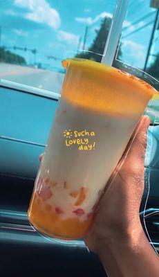 Passionfruit milk tea with passionfruit popping pearls rainbow jelly more sweet less ice