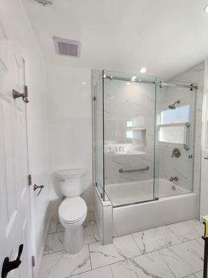 Bathroom tub remodel with a frame less shower glass door excellent job