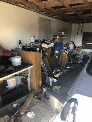 Garage full with appliances and other items before disposal