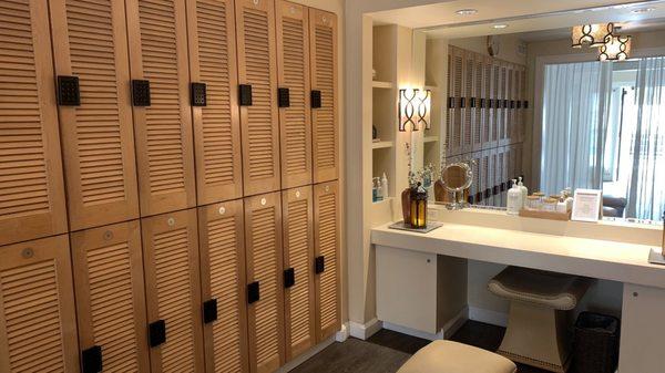 Women's lockers with small vanity area and toiletries