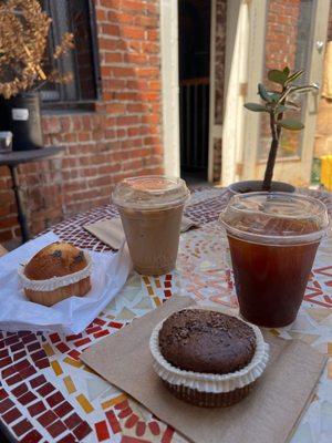 Iced latte, iced americano, lemon poppyseed muffin and a vegan sweet potato flax seed muffin