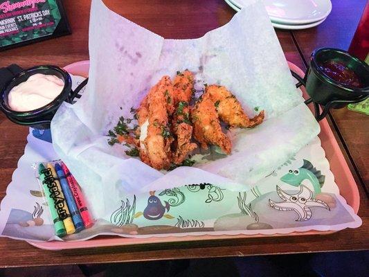 Chicken Tenders served on a school lunch tray with crayons & coloring sheet.