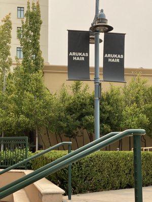 Banners outside salon in plaza