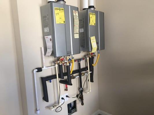 Dual tankless water heaters with circulating pump.