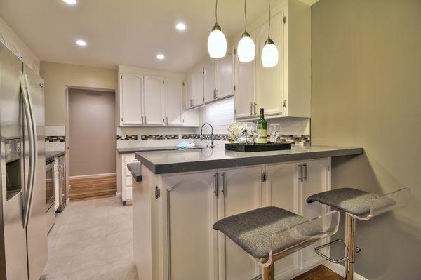 Tile floor, back splash and granite counter top plus created a bar! Inca Marble Great Job!