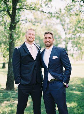 Arizona Cardinals player Josh Mauro wearing a ready-made suit tailored to fit and former NFL player Ben Gardner wearing a custom suit.