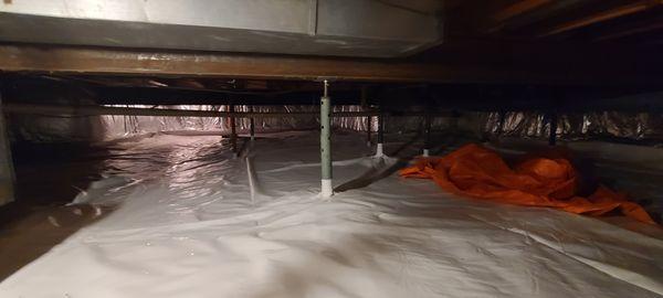 12 mil crawlspace vapor barrier reinforced to 15 mil, and R-19 fiberglass insulation with silver reflective facing on the crawlspace walls