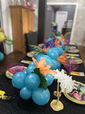 Stunning tropical tablescape that is eco-friendly and elevates the party mood.