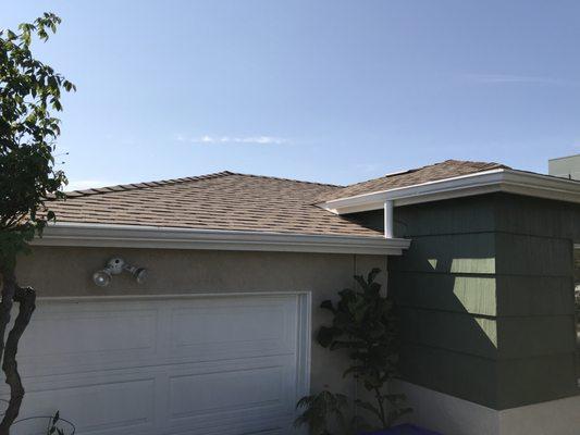 High gloss white aluminum gutters and 3" round downspout