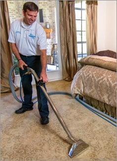 Our technician cleaning carpet