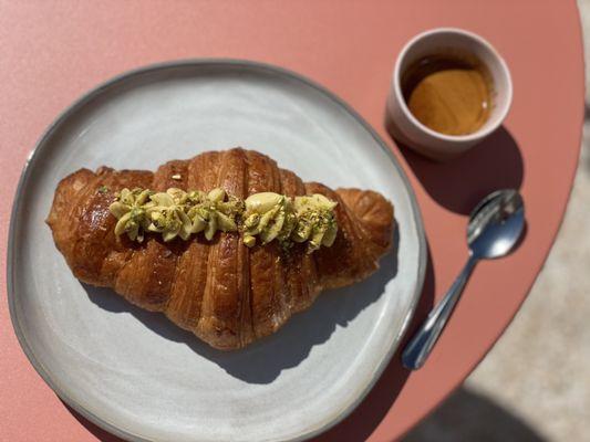 Pistachio croissant and an espresso