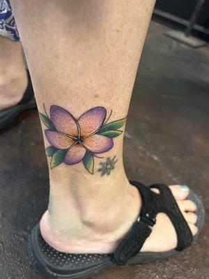 I had the plumeria flower placed next to my very first tattoo. I got in 1998. Both have a lot of meaning for me.