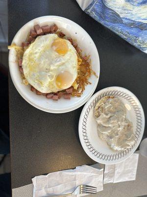 The usual ham, sunny side up eggs, cheese and hash brown bowl  Added biscuits and gravy, too!