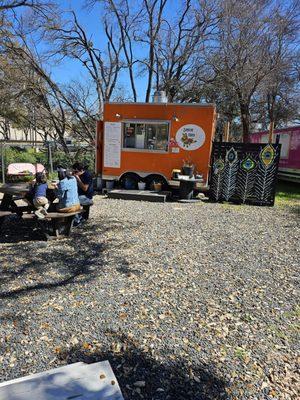 Located in a food truck park and was slightly hidden but well worth finding!  Picnic tables are available to relax and eat in peace.