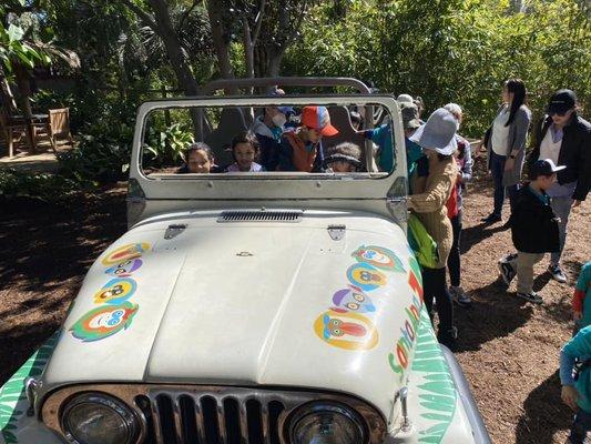 Valencia primary student getting to see what it's like to ride a ranger's car.