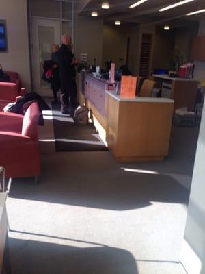 Front desk and waiting area. It's very clean and modern.