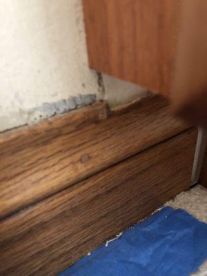 A photo of the bottom of a custom cabinet AKB installed.  It is 3 inches above the baseboards.  I had to have the cabinets replaced.