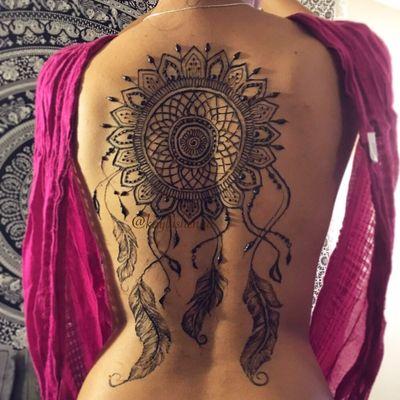 A custom dream catcher back piece to complete her Pocahontas Halloween costume.