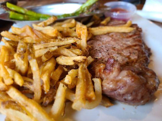 New York Strip with asparagus and fresh cut fries