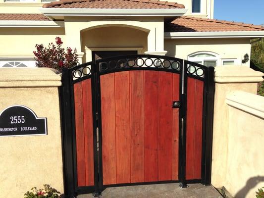 Wrought iron  swing gate with 1x6 clear cedar installed By R&S