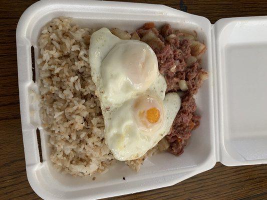 Cold hard garlic rice with bland corn beef and unseasoned stale eggs. Can be yours for $9 hahaha Garbage Food and horrible service.