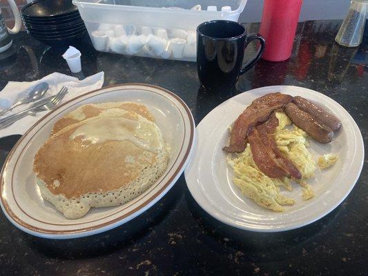 One of their breakfast combos, pancakes, bacon, sausage, and eggs.