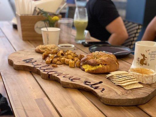 Empanada, roasted potatoes, croissant sandwich and  & crackers - someone else's order  Snapped a pic before we all figured it out