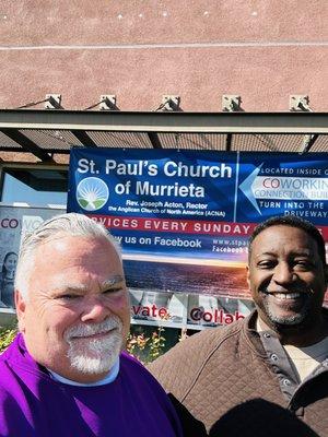 Couple a guys... Father Joseph and Dexter Pierson admiring our new banner.