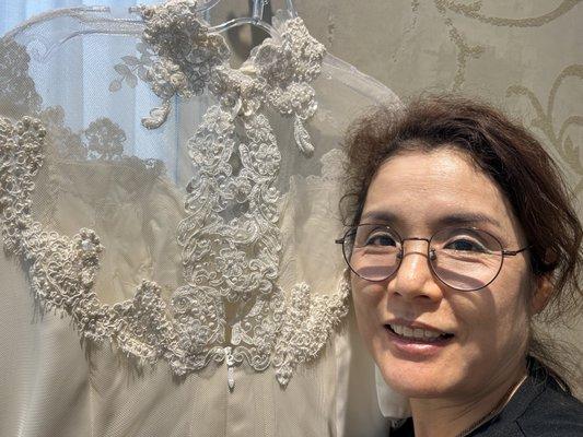 Owner of B&K next to her beautiful lace creation at the back of my wedding dress