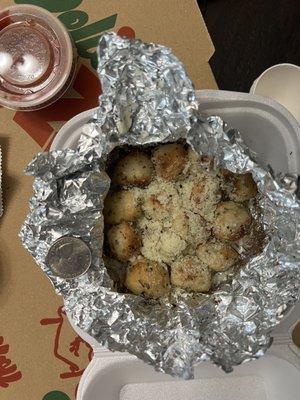 Garlic nuts, quarter for scale.