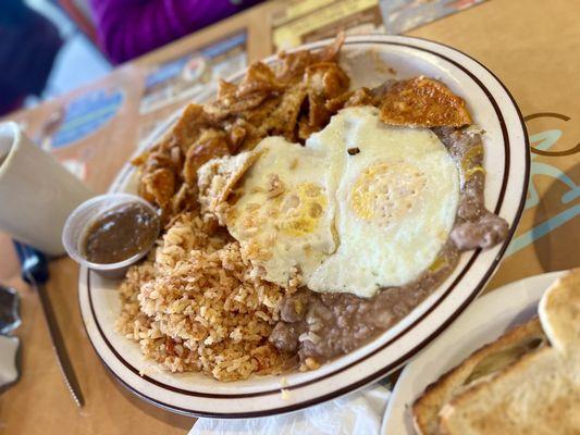 Chilaquiles with red sauce, Rice, Beans & Over Easy Eggs