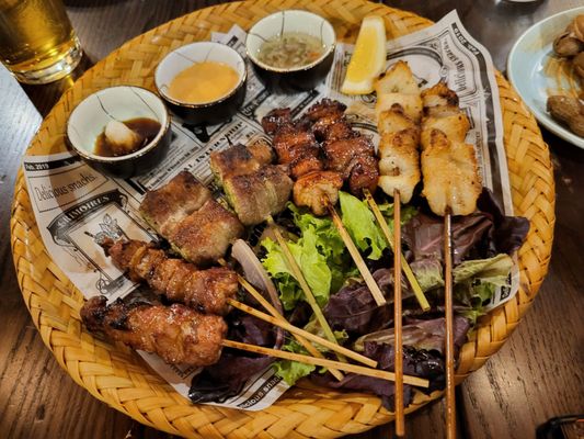 Skewers from right to left (set of 2): pork , pork and leek, Chilean seabass