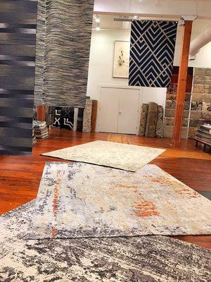 Hanging rugs from a new shipment at our gallery in Portland Oregon.