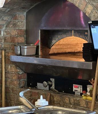 Wood-fired pizza oven.