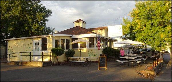 I "opened" up Jenn's Cafe as Theresa wipes down patio tables.