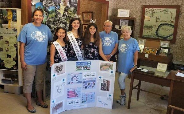 My daughter, Miss University of South Florida, and her two Sunshine Princesses presenting a board on endangered species to Camp Bayou