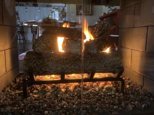 New fireplace logs, grate and embers.