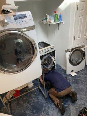 Steven busy fixing a Samsung front loader washing machine.