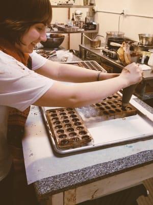 Here I was filling the ganache center of the chocolates