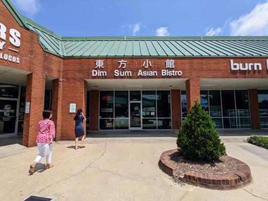 Outside. Storefront. Tucked away in the Greenwood Commons shopping center on 55 (Apex Hwy).