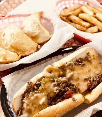 Steak, fries, and pierogi.