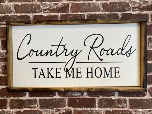 Country Roads Take Me Home wall art with reclaimed wood frame.